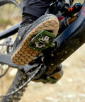 Close-up of shoe engaging with Ultra Thin Mountain Bike Clip Pedals Orange With Extra Large DH Sized Platform 26.8mm Profile