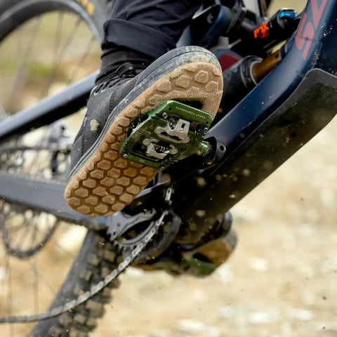 Close-up of shoe engaging with Ultra Thin Mountain Bike Clip Pedals Orange With Extra Large DH Sized Platform 26.8mm Profile