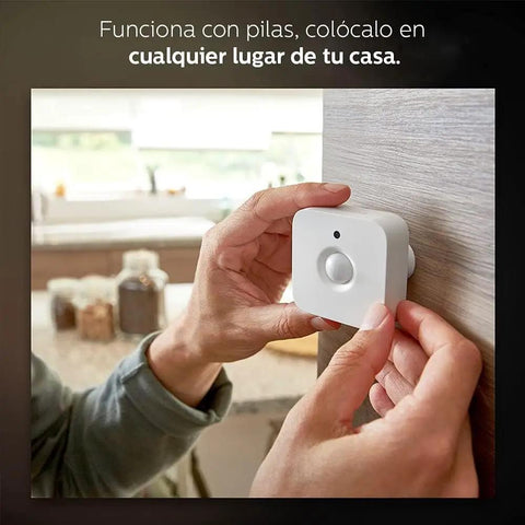 Person installing motion sensor on wall; part of the Motion Sensor Bundle With Two White A19 LED Bulbs For Smart Home Lighting Hands Free Activation