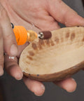 Mini Cordless Rotary Tool Kit With 105 Accessories in use on wooden bowl