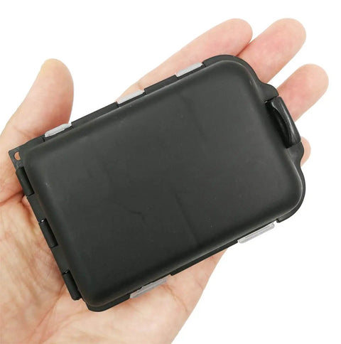 Hand holding a Two Pack Small Hard Fishing Tackle Box Portable Case With Ten Compartments For Storing Hooks, Lures, Swivels, Jigs, And Sinker Accessories, Lightweight Durable ABS Plastic, Grab And Go Ready For Backpacking, Hiking, Camping