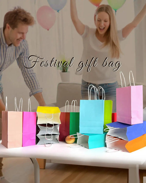 32 Pack Small Paper Gift Bags With Handles In 16 Color Variations displayed on a table, ideal for party favors and crafts.