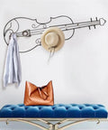 Modern Wall Mount Coat Hooks Dang Handy Entryway Storage Rack Easily Hangs Coats Jackets And Keys With Heavy Duty Steel Frame Built For Everyday Grind At Home featuring a stylish violin design with a jacket and hat.