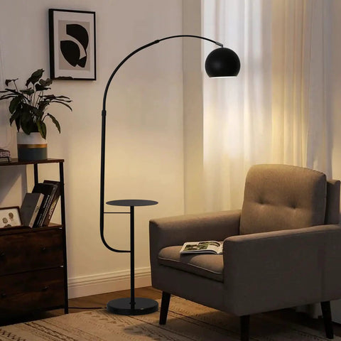 Black Floor Lamp With Marble Table Base 79 Inch Modern Industrial Arc Lamp next to armchair in cozy living room