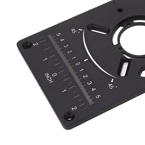 Close-up of Heavy Gauge Aluminum Router Table Insert Plate With Four Durable Rings And Metric Imperial Scale showing inch markings.