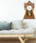 Metal Clock Pendulum Replacement Part 8.26 x 3.54 Inch in wall-mounted clock beside cream sofa with green pillow