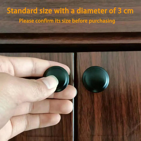 Hand installing Matte Black Cabinet Knobs 10 Pack 1.2 Inch Round Zinc Alloy Drawer Pulls For Dresser Cabinets Kitchens Modern Single Hole Hardware