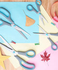 Four Piece Scissors Set with Premium Stainless Steel Blades and Ergonomic Semi Soft Rubber Grip for School, Office, and Home Use; Four Sizes in Blue and Gray Displayed on Colorful Paper Background