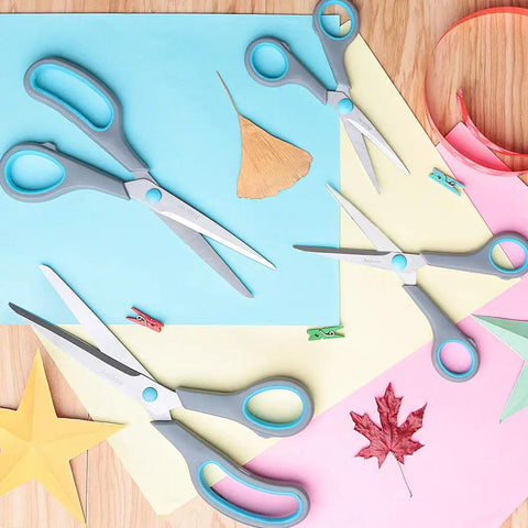 Four Piece Scissors Set with Premium Stainless Steel Blades and Ergonomic Semi Soft Rubber Grip for School, Office, and Home Use; Four Sizes in Blue and Gray Displayed on Colorful Paper Background