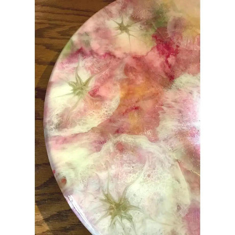 Close-up of a 15 Inch Rustic Farmhouse Round Wooden Lazy Susan Centerpiece with pink and green floral design