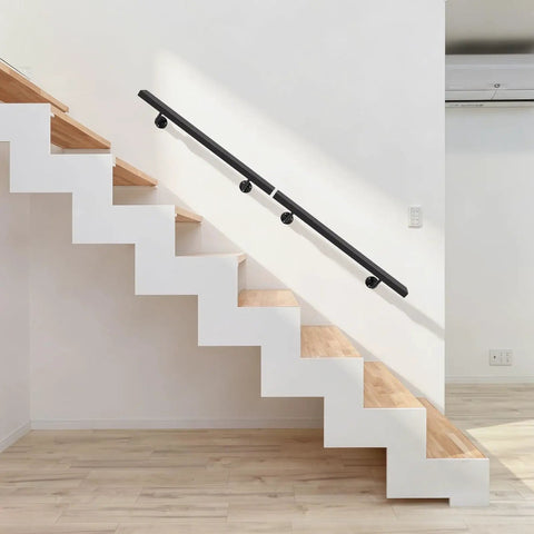Heavy Duty Wall Mounted Stair Handrail Built From Premium Stainless Steel Providing A Rock Solid Grip And A Slick Black Finish For Dependable Daily Use And Home Safety installed on modern staircase.