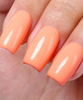 Close-up of nails polished with Coral Orange Gel Nail Polish 10ml HEMA Free UV LED Cure Soak Off Long Lasting Summer Formula