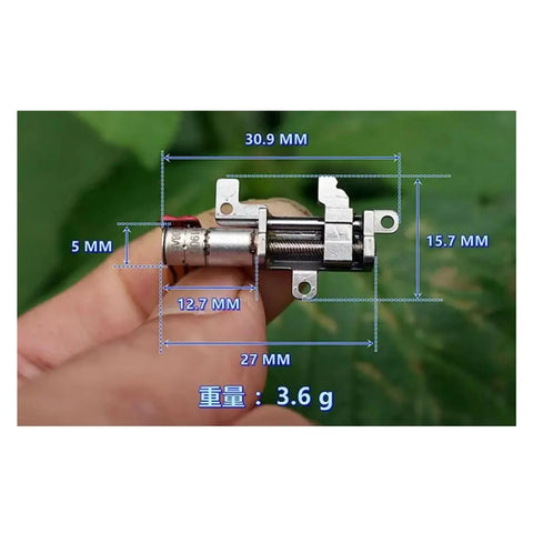 Tough As Nails 8Mm Travel Planetary Gear Stepper Linear Actuator dimensions shown in hand, featuring rugged aluminum casing and compact design.