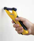 Person using MetalliScanner M40 Handheld Electronic Metal Detector on a wall for Drywall Concrete Lathe and Plaster Stucco detection.