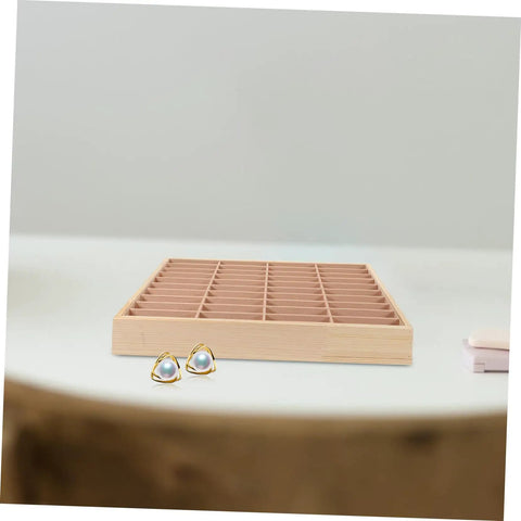 Totally Game Changing Wood Jewelry Tray With Plush Suede Grid Organization Board featuring 40 dedicated spaces and pearl earrings.