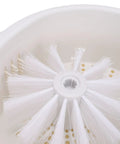 Interior view of Straight Up Game Changer Electric Salad Spinner With Rapid Drain Tech, featuring cleaning brush and draining holes.