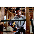 Person using Atomic 20V Max One-Handed Cordless Reciprocating Saw Tool Only With Brushless Motor in construction site
