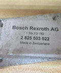 Bosch Rexroth AG Connection Plate PN 2 825 503 022 in original packaging on a wooden surface