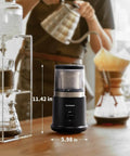 One Touch Coffee And Spice Grinder With Removable Stainless Steel Cup for coffee beans spices and seeds on kitchen counter.