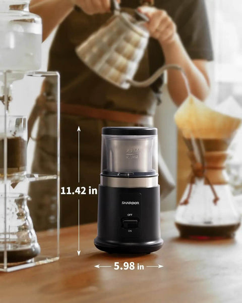One Touch Coffee And Spice Grinder With Removable Stainless Steel Cup for coffee beans spices and seeds on kitchen counter.