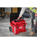 Gutsy Modular Tool Tray For Tradesmen Heavy Duty Plastic Organizer with tools being accessed, on a workspace with wheels.