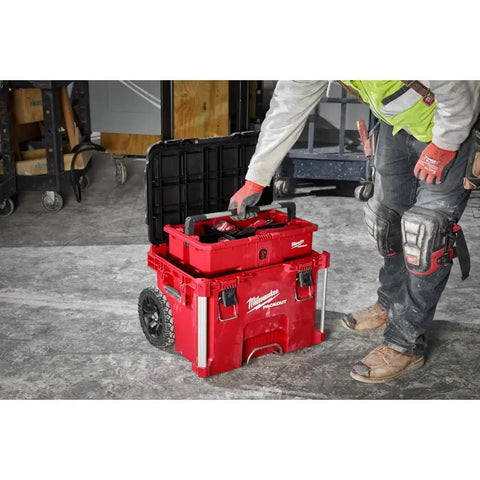 Gutsy Modular Tool Tray For Tradesmen Heavy Duty Plastic Organizer with tools being accessed, on a workspace with wheels.
