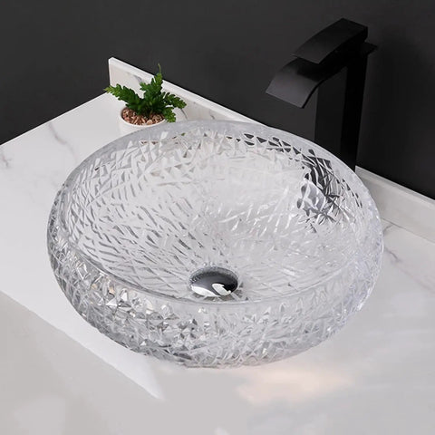 Top Notch Round Glass Vessel Sink Paired With A Sleek Waterfall Faucet Combo Solid Crystal Bathroom Vanity Bowl on white counter.