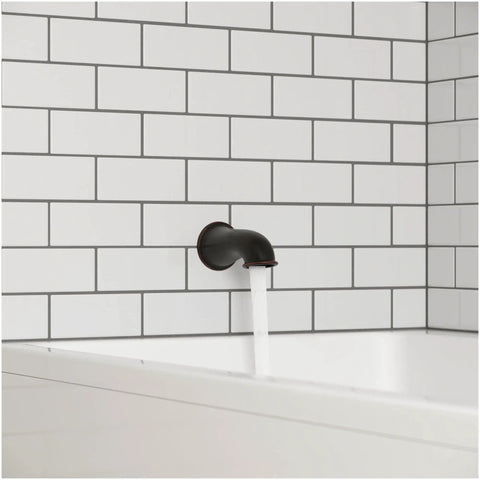 Non Diverter Tub Spout With Tuscan Bronze Finish All Metal Construction Traditional Style Mounts Easy Install Durable Bath Spout With Limited Lifetime Warranty For Long Lasting Performance installed in white tile bathroom wall