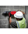 Hella Tough 18V Cordless Cut Off Saw Kit For Concrete And Masonry Includes Two 12.0 Ah Batteries Rapid Charger 9 Inch Diamond Blade abrasive disc in use on concrete wall.