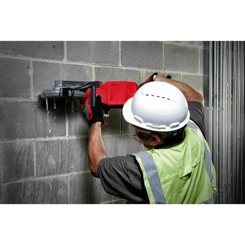 Hella Tough 18V Cordless Cut Off Saw Kit For Concrete And Masonry Includes Two 12.0 Ah Batteries Rapid Charger 9 Inch Diamond Blade abrasive disc in use on concrete wall.