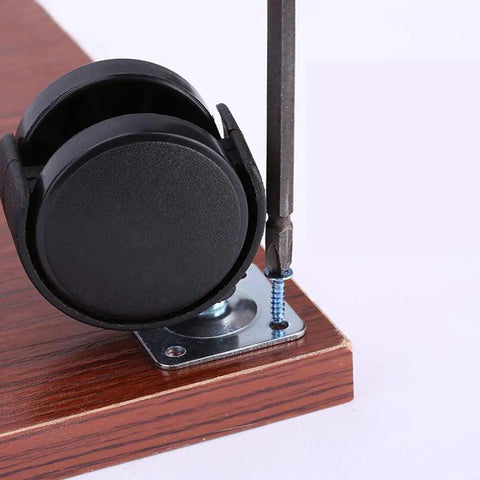 Double Wheel Nylon Casters For Furniture 1.5 To 2 Inch Wheels with screwdriver and screws on wooden surface