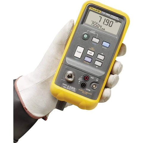 Slick One Hand Electric Pressure Calibrator with digital display and controls held in a gloved hand for precision calibration.