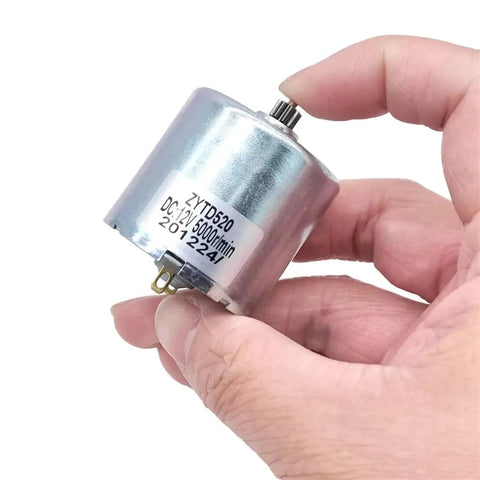 Heavy Duty 12V DC Motor ZYTD520-03C PM Replacement For 520-03B Engine in hand, showcasing smooth design and efficiency.