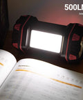 Rechargeable Camping Lantern With 1500 Lumen Output And 8 Lighting Modes illuminating a book with side light indoors.