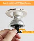 Hand holding 50W GU10 Halogen Bulb for Candle Warmer Lamps, showing easy installation in GU10 base.