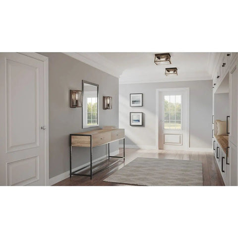 Briarwood Antique Bronze One Light Wall Sconce With Faux Wood Look illuminating a farmhouse-inspired hallway interior.