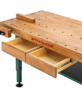 Heavy Duty Solid Oak Workbench With Bulletproof Steel Legs And Dual Vise Setup featuring storage drawers and holes in the oak top.