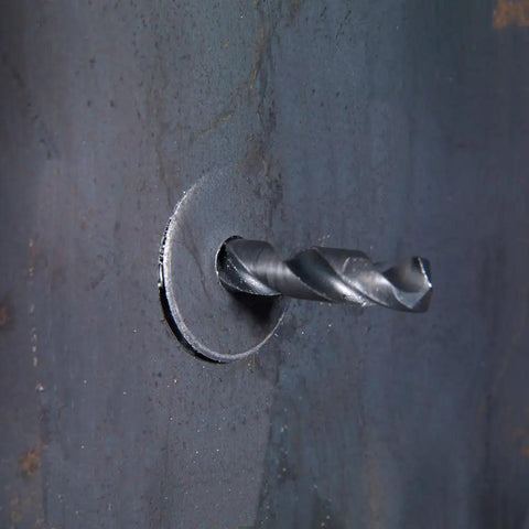 7 3/4 Inch Tungsten Carbide Tipped Hole Cutter drilling steel plate for metalworking, showcasing deep clean cut hole