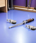 Beefy 4 Pack Stainless Steel Pulley Block Set For Kayak And Sailboat Rigging on workshop table with tools.