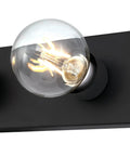 Close-up of bulb on Four Light Vanity Light Fixture in Matte Black Low Profile Backplate Fits Tight Spaces Between Cabinets and Ceiling.