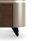 Close-up of furniture with adjustable aluminum cabinet feet with anti-slip design, black legs under a wooden and beige cabinet