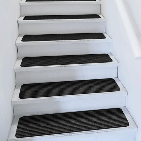 Set of 15 Skid Resistant Double Ribbed Carpet Stair Treads Smokey Black 9x36 Inches Non Slip Backing on white stairs