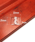 Close-up of a clear acrylic 25x33mm hinge on wood. Pack Of 10 Transparent Plastic Folding Hinges In 25x33 30x33 38x45 And 65x42 Sizes Built To Last Transparent Clear Acrylic Hinges For DIY Projects Cabinets Boxes And Craft Builds.