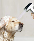 Person using Pet Shower Attachment Kit with Handheld Sprayer on large dog, showing 8Ft Flexible Stainless Steel Hose in use