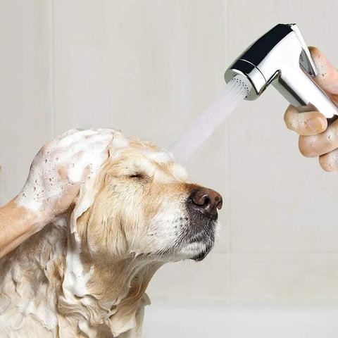 Person using Pet Shower Attachment Kit with Handheld Sprayer on large dog, showing 8Ft Flexible Stainless Steel Hose in use