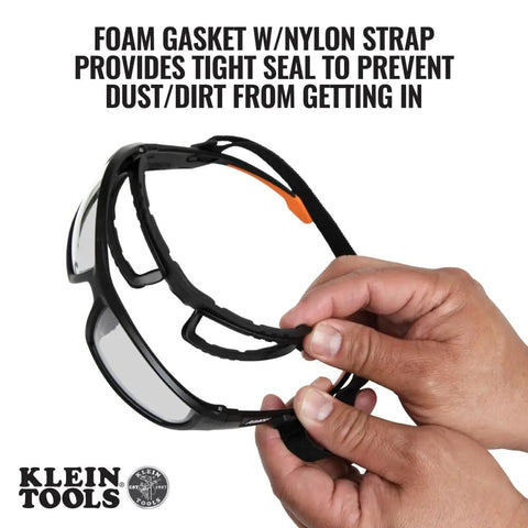 Hand holding Gasket Safety Glasses For Worksite PPE Eye Protection With Full Frame Design Pro Grade Anti Fog Lenses
