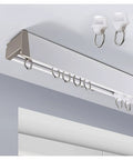 Premium Aluminum Ceiling Mount Curtain Rail With Double Groove Blackout Track installed on a ceiling with smooth sliders