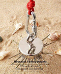 Neosmuk fishing magnet with red rope and carabiner; large silver neodymium magnet on sandy beach