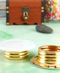 Slick Copper Fire Sprinkler Covers Decorative Escutcheon Caps set of two, white caps with gold rings for head protection.
