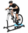 Cyclist using Detachable Indoor Bike Roller Trainer Stand For 24 To 29 Inch Mountain Bikes, Anti Slip Platform, Foldable Front Wheel Quick Release Setup
